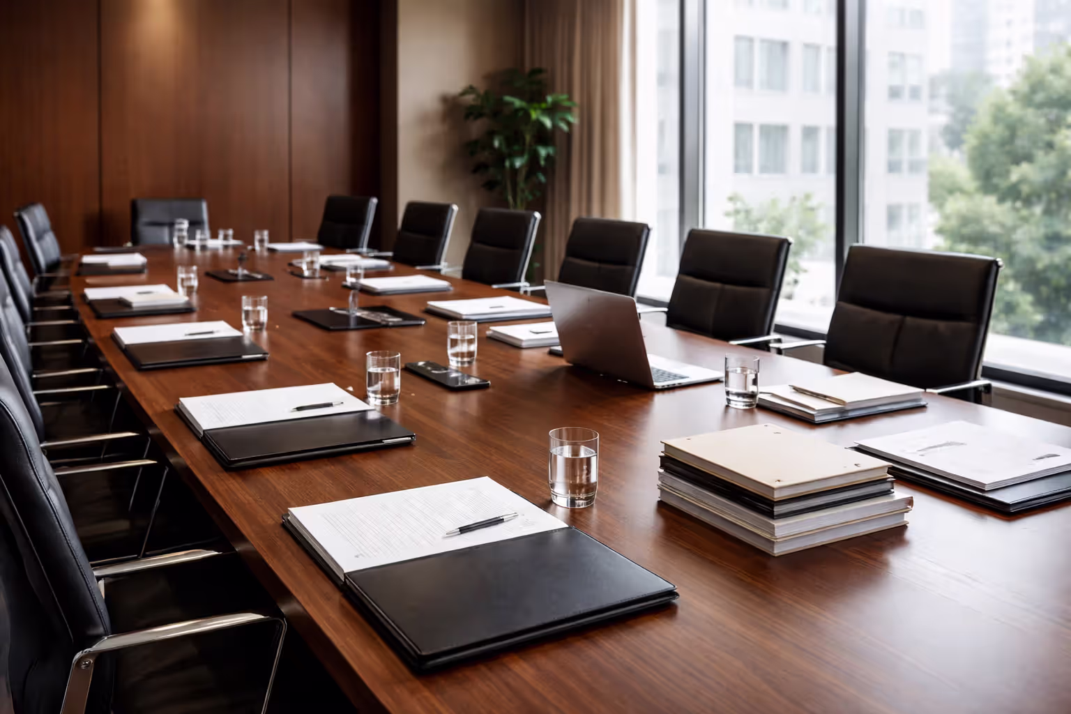 Conference room table with organized legal documents and folders during wrongful death case discovery phase